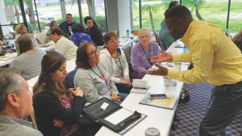 Lea dives deeper in discussion with a small group.