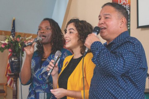 The praise team lifts their voices in song.