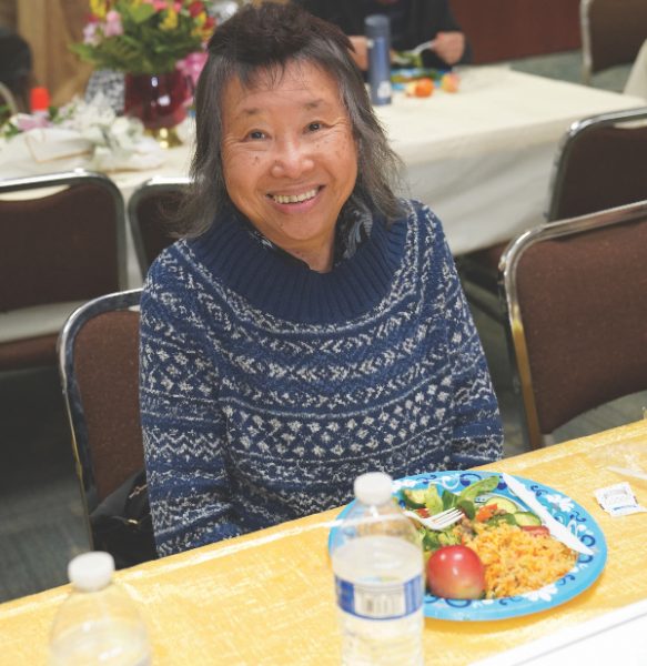 Amy Lou enjoys the graduation lunch celebration.