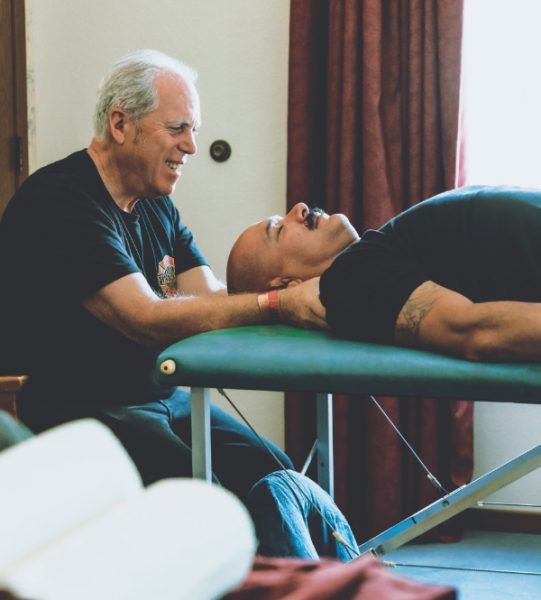 An attendee relaxes with a massage.