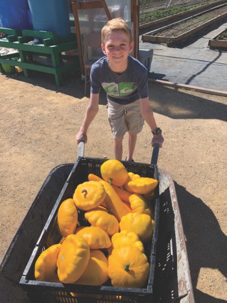 Wade Wernick helps with a wheelbarrow.