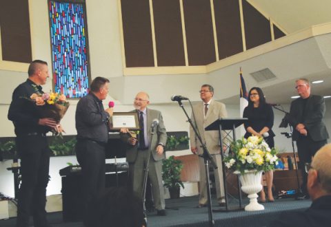 <p>From left to right: Ed Sammons, pastor; Keith Harrison, head elder; John H. Cress, SCC executive secretary; Velino A. Salazar, SCC president; Kathleen V. Diaz, SCC treasurer/CFO; and Greg Hoenes, SCC West Region director. Cress presents Harrison with a plaque commemorating Lancaster church’s 100th anniversary.</p><p>De izquierda a derecha: Ed Sammons, pastor; Keith Harrison, primer anciano; John H. Cress, secretario ejecutivo de SCC; Velino A. Salazar, presidente de SCC; Kathleen V. Diaz, tesorera/CFO de SCC; y Greg Hoenes, director de la Región Oeste de SCC. Cress presenta a Harrison una placa conmemorativa del 100º aniversario de la iglesia de Lancaster.</p>