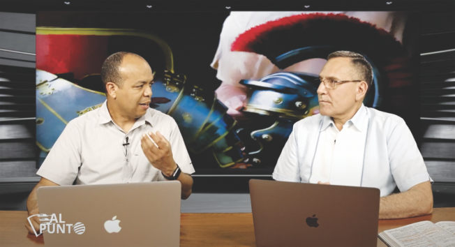 <p>Enrique Baez (left) and Guillermo Quiroz (right) discuss a Sabbath School lesson.</p><p>Enrique Báez (izquierda) y Guillermo Quiroz (derecha) hablan sobre una lección de Escuela Sabática.</p>