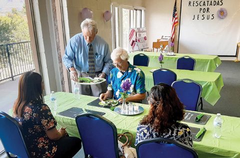 Pastor Dale Morgan serves food at the New U Café