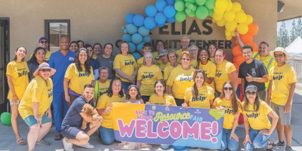 Volunteers and vendors welcome families to the Community 
Back-to-School Resource Fair.