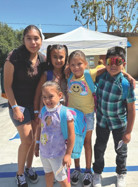 Kids sport their new backpacks