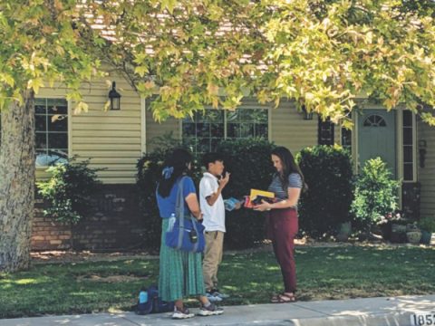 Jeremiah Yang and Isabel Cruz share the gospel through the printed page.