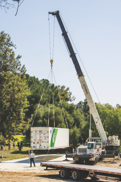 Freight Farms delivers the first shipping container to La Sierra University in March 2021 for use by the school's Enactus team in its hydroponics agriculture and educational outreach projects. The team grew varieties of lettuce in the environmentally controlled, high-tech freight and participated in education activities with local high school students.