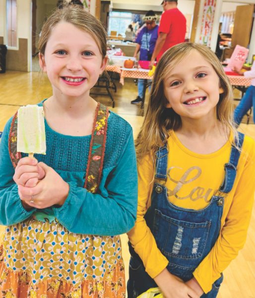 Adeline Waring and Alyssa Coehlo enjoy the frozen paletas treats.
