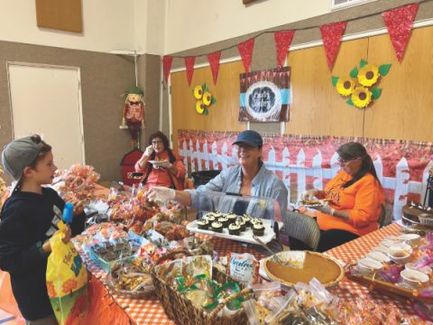 The baked goods booth, with Judy Phelps, Emy Silva, and Susan Beckett.