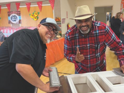 NUC President Carlos Camacho and Pastor Rudy Alvir sell frozen Mexican paletas.