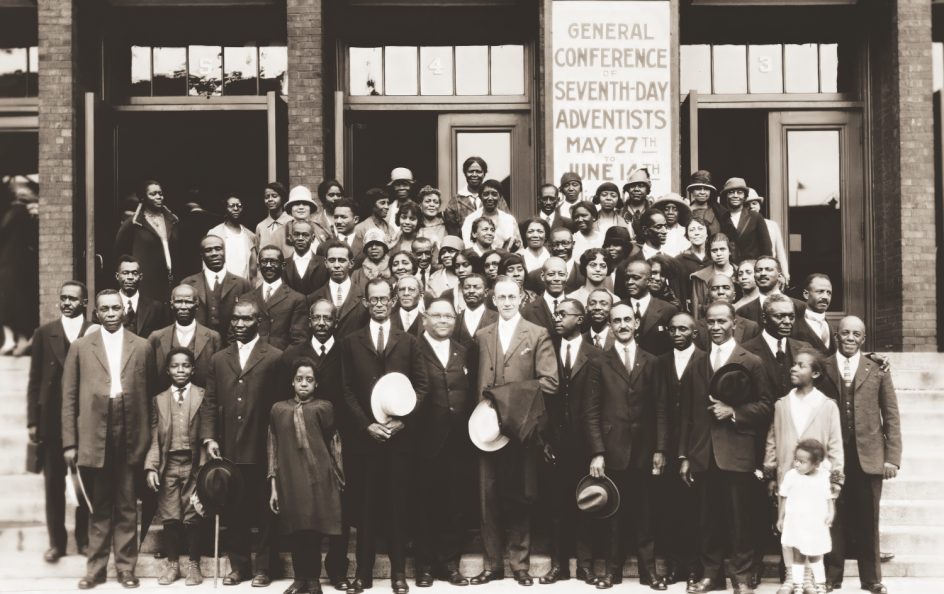<p>Rodgers in front row with Black delegates and guests
 at the 1926 General Conference Session, Milwaukee, Wisconsin.</p><p>Rodgers en primera fila con delegados negros e invitados en la Sesión de la Conferencia General de 1926, Milwaukee, Wisconsin.</p>