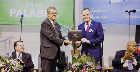 SCC President Velino A. Salazar presents Mendez with his ordination certificate.