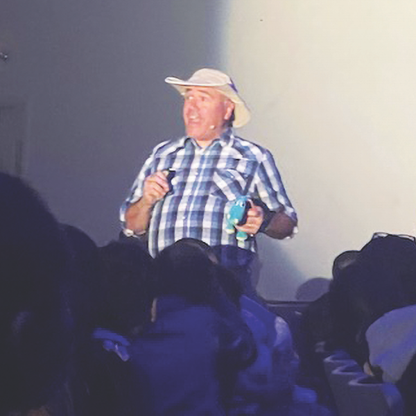 Rich Aguilera gets ready to give a prize to one of the kids in the audience, who correctly answered the question during the game show segment of the Dinosaur Encounter show.