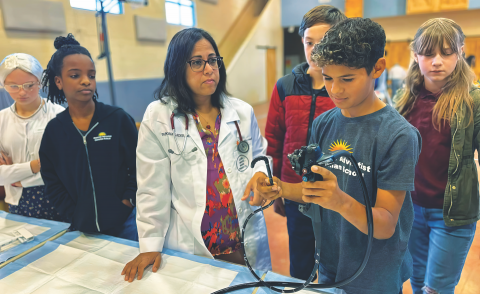 Students participate in a scavenger hunt around the school property.