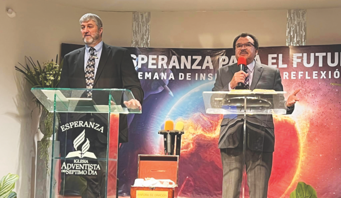 Arizona Conference President Ed Keyes (left) preaches at the Tucson Esperanza Spanish church as part of the ongoing Hispanic Ministries evangelism program.