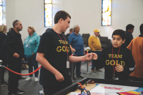 Teammates from Team Gold from Ridgecrest Adventist Elementary encourage each other before their next round begins.