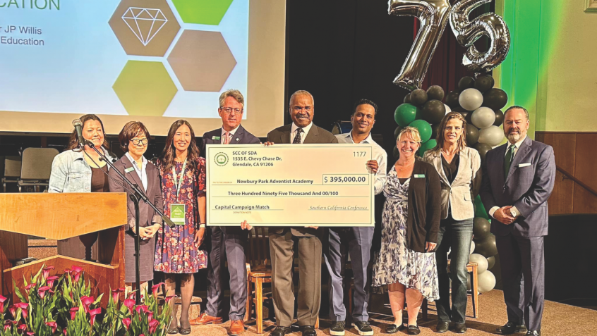 <p>Southern California Conference matches the funds raised so far with a check for $395,000. Left to right: Jeni Lowe Bello (’97), alumni homecoming committee co-chair; Paulette Park, NPAA vice principal and math teacher; Laurie Ross, alumni homecoming committee co-chair; Joel Albritton (’88), NPAA principal and English teacher; JP Willis II, SCC vice president for education; Sunil Ilapogu, NPAA capital campaign committee chair; Melanie Rivera, NPAA treasurer; Marlena Jahn, NPAA finance committee chair; and John Negley, NPAA school board chair.</p><p>Southern California Conference iguala los fondos recaudados hasta ahora con un cheque de $395,000. De izquierda a derecha: Jeni Lowe Bello (‘97), copresidenta del comité de bienvenida de exalumnos; Paulette Park, subdirectora de NPAA y maestra de matemáticas; Laurie Ross, copresidenta del comité de bienvenida de exalumnos;
Joel Albritton (‘88), director de NPAA y profesor de inglés; JP Willis II, vicepresidente de educación de SCC; Sunil Ilapogu, presidente del comité de la campaña de capital de NPAA; Melanie Rivera, tesorera de NPAA; Marlena Jahn, presidenta del comité de finanzas de NPAA; y John Negley, presidente de la junta escolar de NPAA.</p>