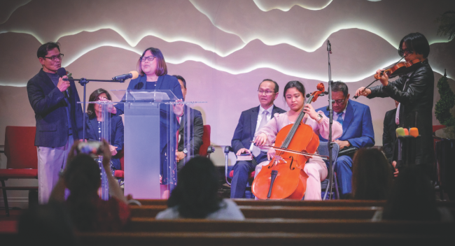 Maria Ejurango and her family share a special song at her ordination.