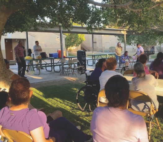 Dr. Andres Ramirez leads out in a health seminar for the neighborhood.