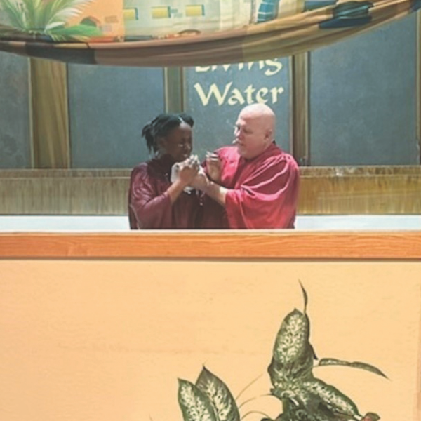Pastor Vince Woolsey baptizes a young person who attended the Hero’s VBS program at Mesa Palms.