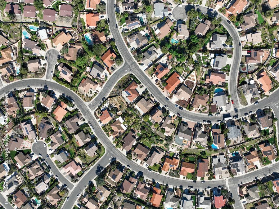 Aerial top view of middle class neighborhood with villas in South California, USA