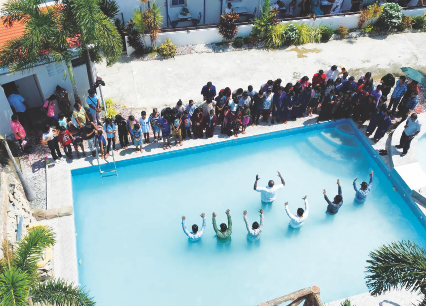 116 people are baptized in the hotel pool.
