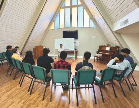 The Youth Rush team has a worship devotional before going out to the communities and ministering door to door.