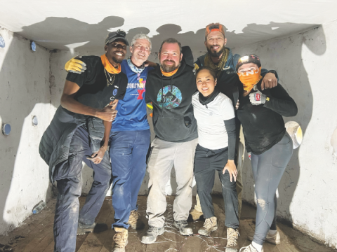 SCC missionaries gather inside one of the finished homes.
