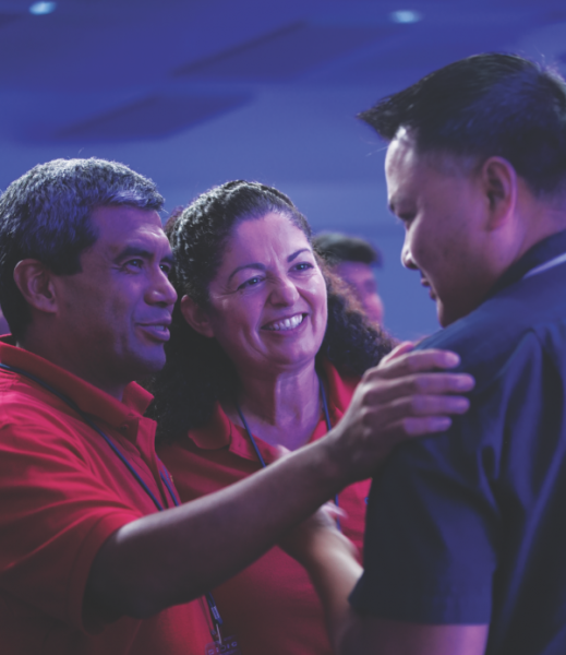 Pathfinder coordinators receive an anointing prayer by Pastor Melvin Ebora.