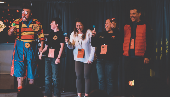 Firehouse retreat attendees enjoy Chagy the Clown's show.