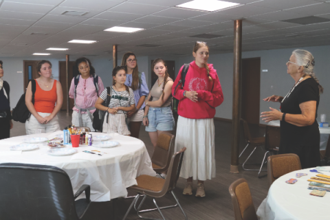 Ms. Della introduces herself before giving instructions for beading class.