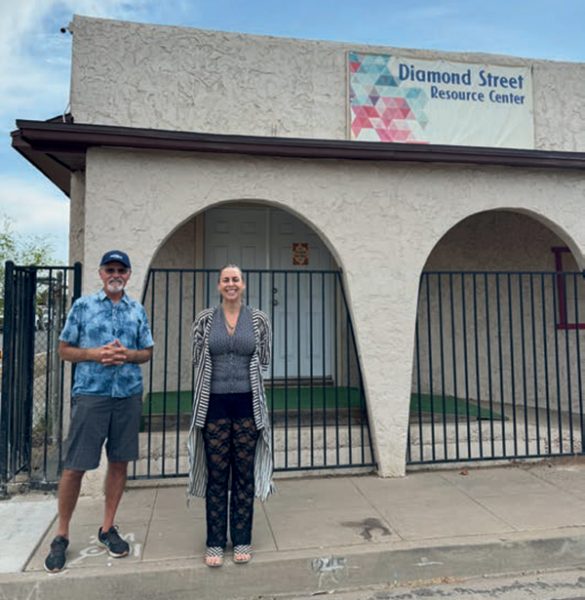Barry Wilkins (left) stands outside the Diamond Street Resource Center in central Phoenix with one of the volunteer healthcare providers that has been offering free mental health counseling for inner city families.