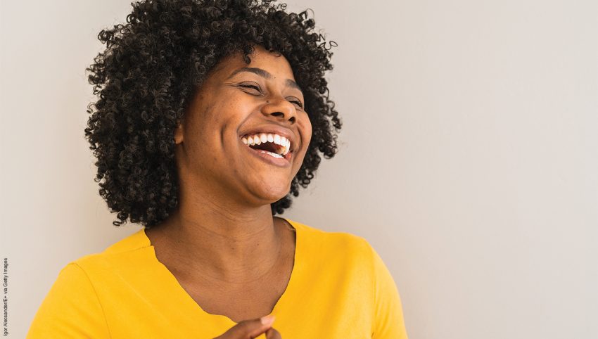 Portrait of a young woman laughing.
