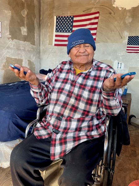 J. R. Sanders showing off both his new God-Pod and his old worn out one.