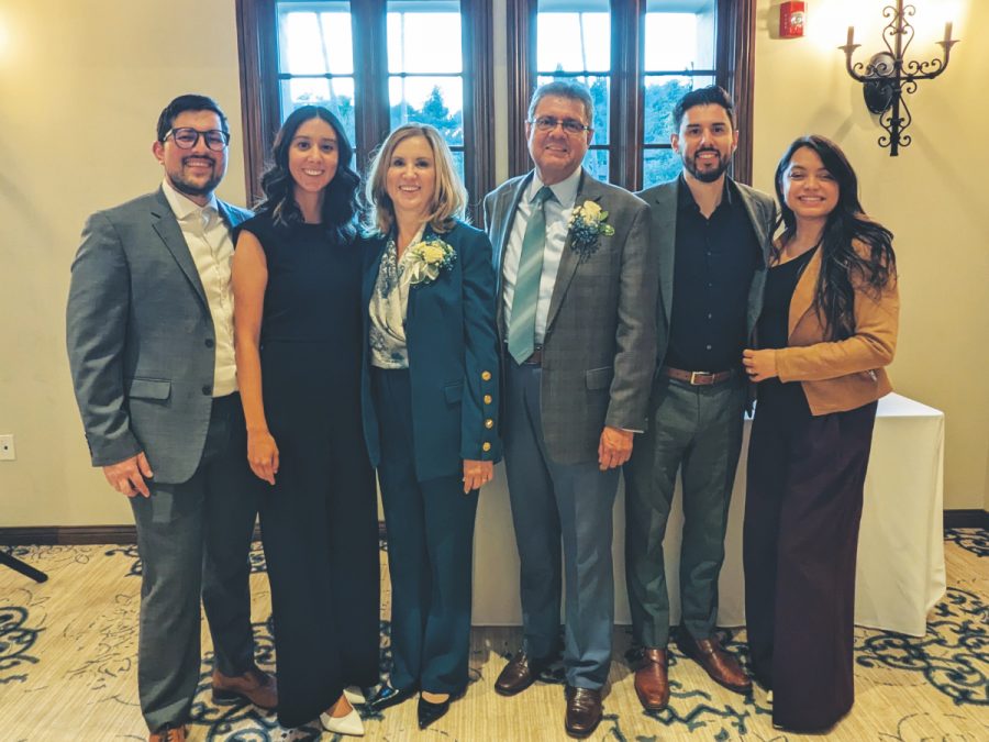 Salazar is pictured with his wife, Esther, and two children, Melissa and Eric, with their spouses (Jose, far left, and Keren, far right), at his retirement party.