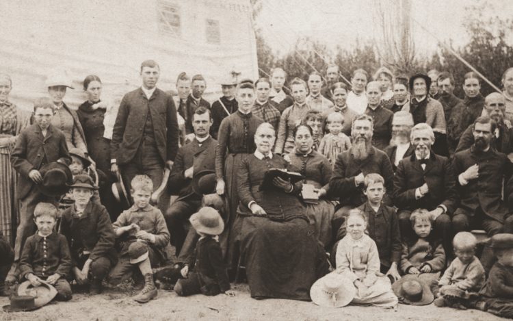 Ellen G. White, seated behind children with open Bible, and J. N. Loughborough, seated second from right, at Reno, Nevada, camp meeting, 1888. (Photo courtesy of Ellen G. White Estate, Inc.)