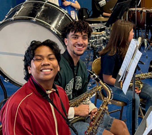 TAA Students Nico St. Ana (left) and Patrick Riffel (right) participate in the band clinic portion of the Music Festival.