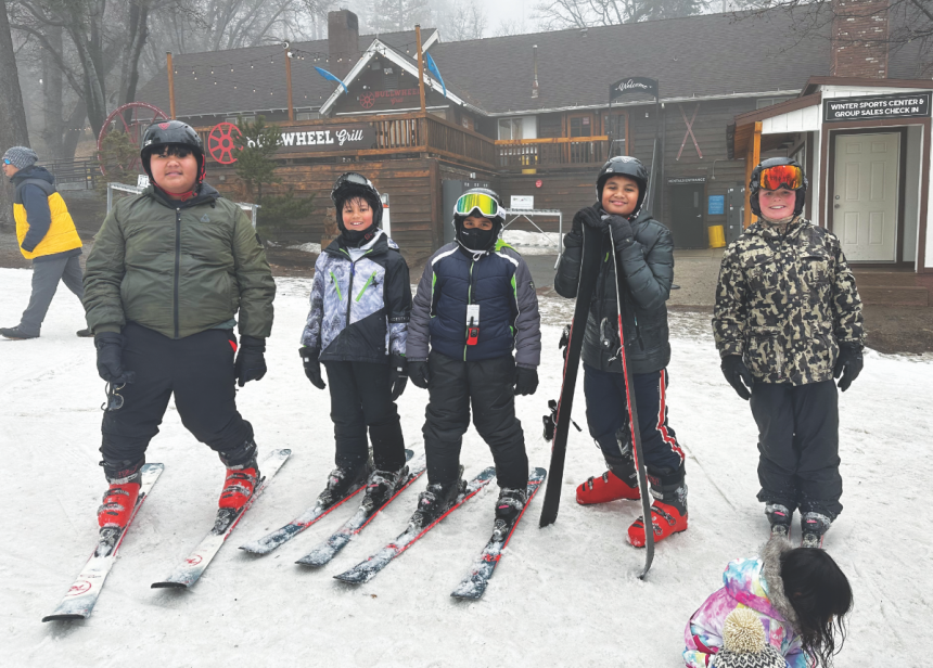 LNJA students take a photo on the slopes in their gear.