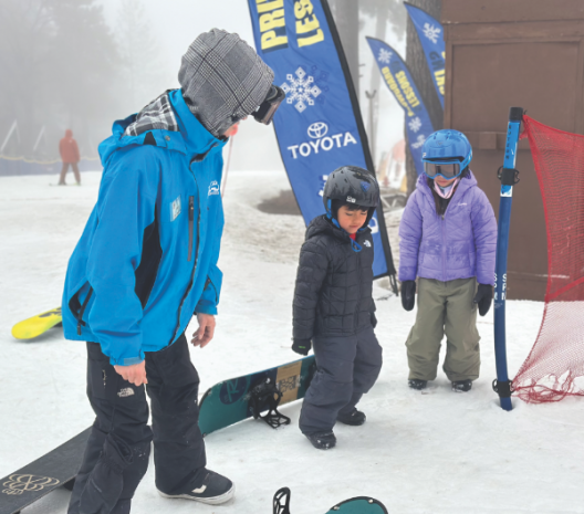 Students learn the basics from an instructor.