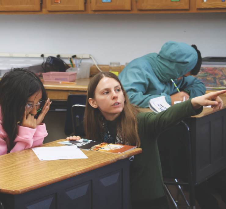 Ms. Babcock explains the reading assignment.