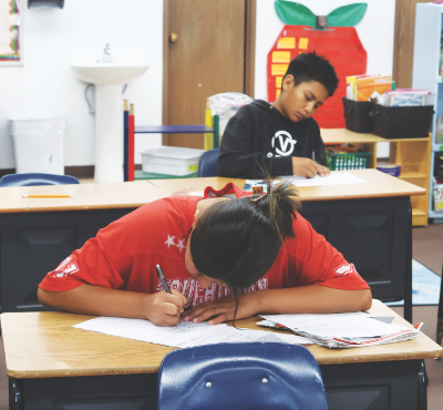 Students work on writing about what they learned.