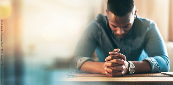 Black man, hands and praying with worship and banner, God and religion, faith with guidance and gratitude. Respect, spiritual and prayer with belief, blessing and mockup space with bokeh and trust