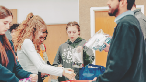 Young people from churches across the area team up to assemble care packages.