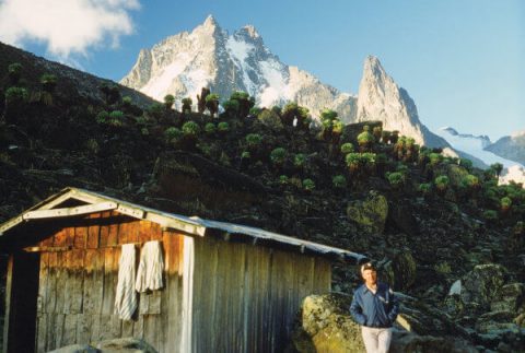 David Meyer at a warming hut, with beautiful Mount Kenya rising to 17,057 feet behind him.