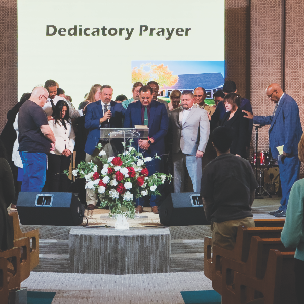 The Victorville church elders and search committee pray over Martinez.