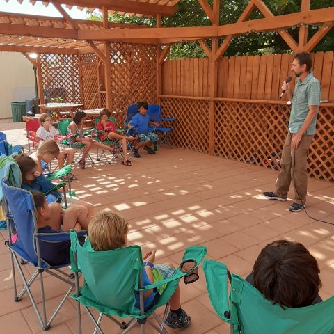 Pastor Crosby leading out in worship during the Page All Nations church annual day camp. Photo: Anne Crosby