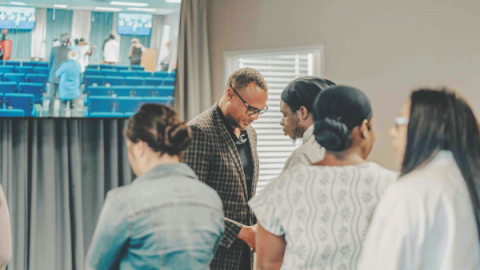 Michael Jenkins Jr. leads the anointing service, calling attendees to step boldly into their role as digital ministers.
