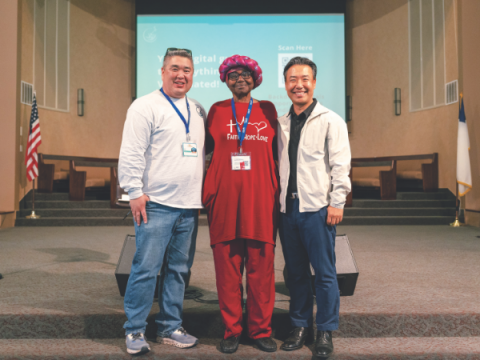 Kim and Park award Apple Valley volunteer Alpha Omega for 50 years of VBS ministry.