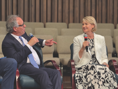 Alan Reinach (left) engages in a conversation with Bettina Krause (right) during the panel discussion.